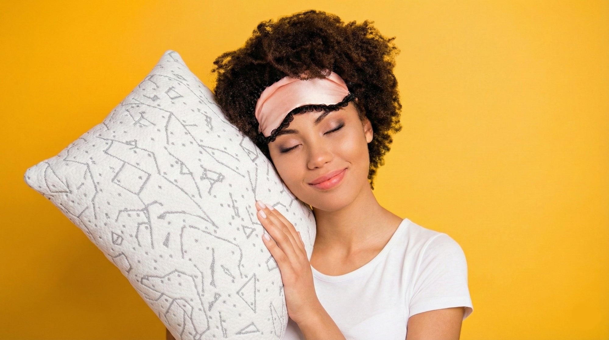 Young happy woman hugging a PineTales Buckwheat Pillow