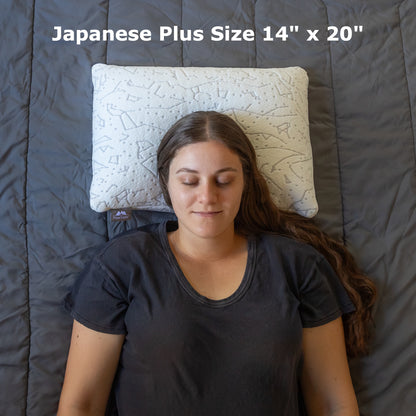 Woman sleeping on her back on a 14 x 20 inch platinum buckwheat pillow with dual side bamboo/cooling cover