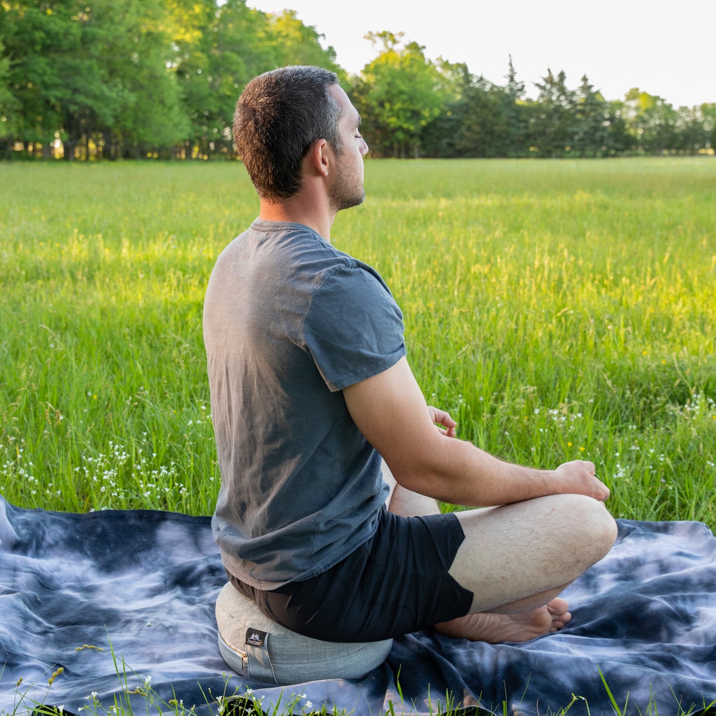 Meditation Pillow - Zafu Outdoor Edition used by young man
