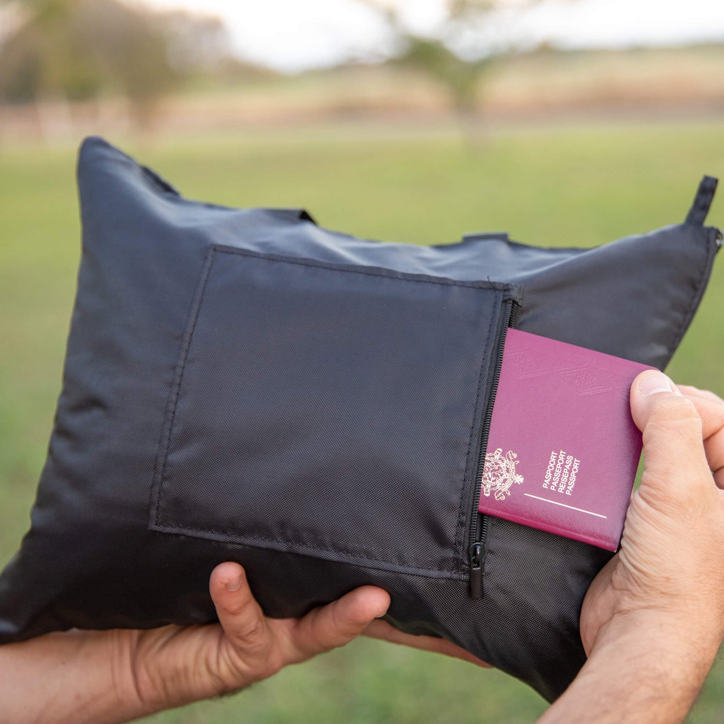 Back side of bag with zippered storage for passports etc.