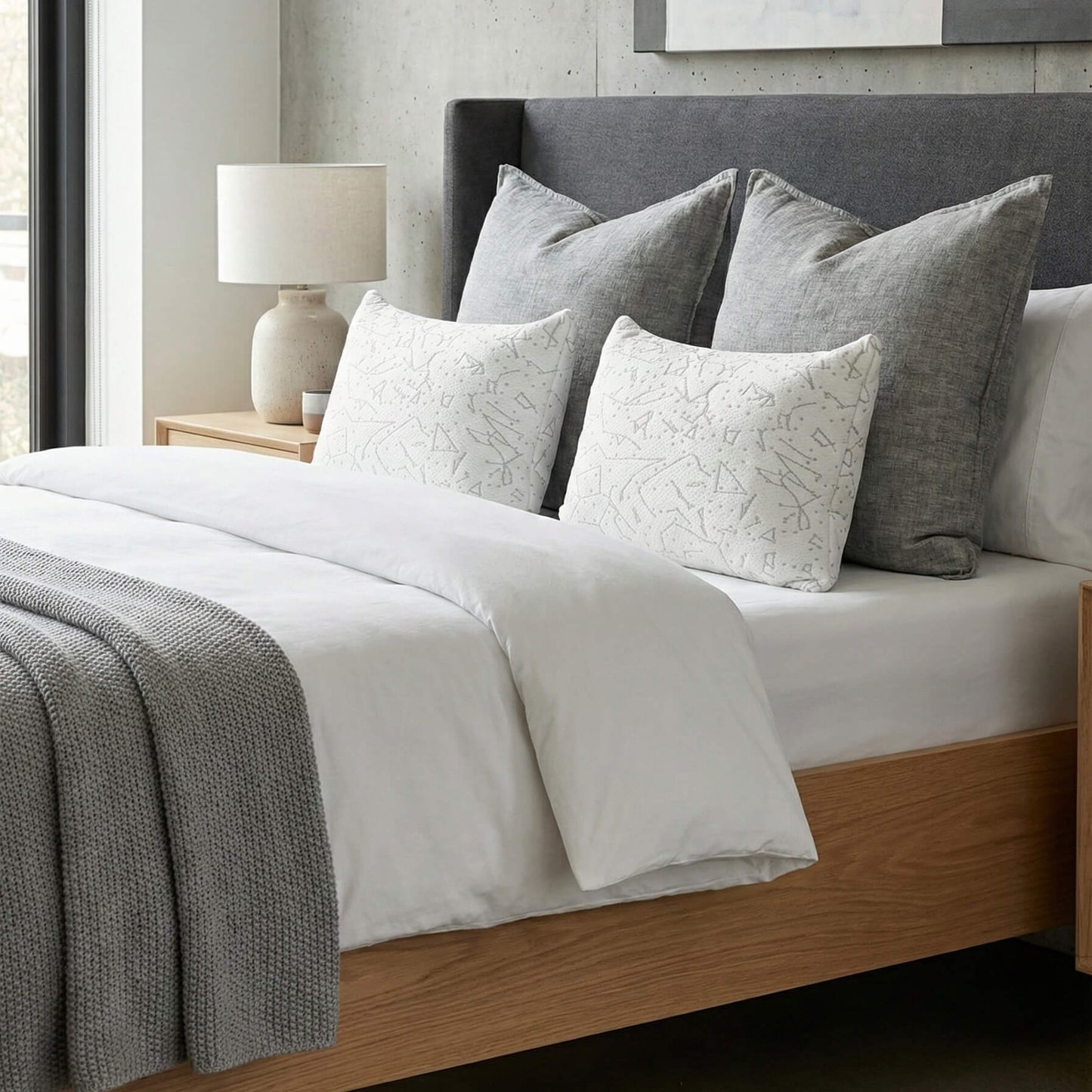 Two Platinum Edition Buckwheat Pillows with Bamboo/Cooling Cover shown on a modern bed