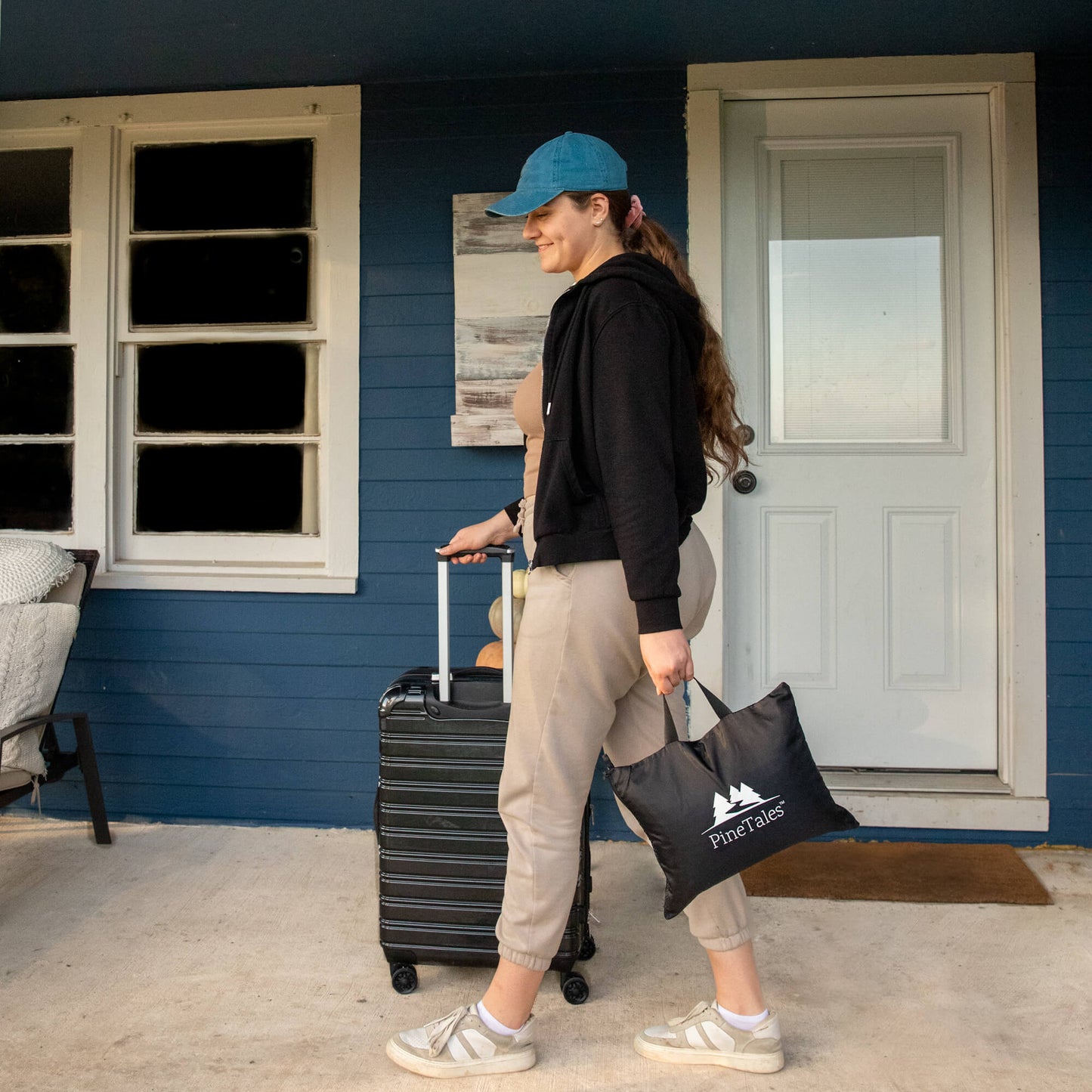 Young Woman carrying the travel pillow in the bag that comes with it