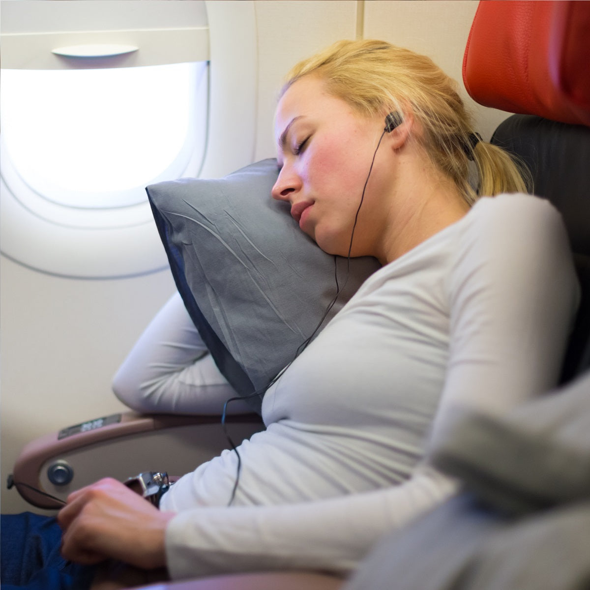 Travel Pillow being used in Airplane